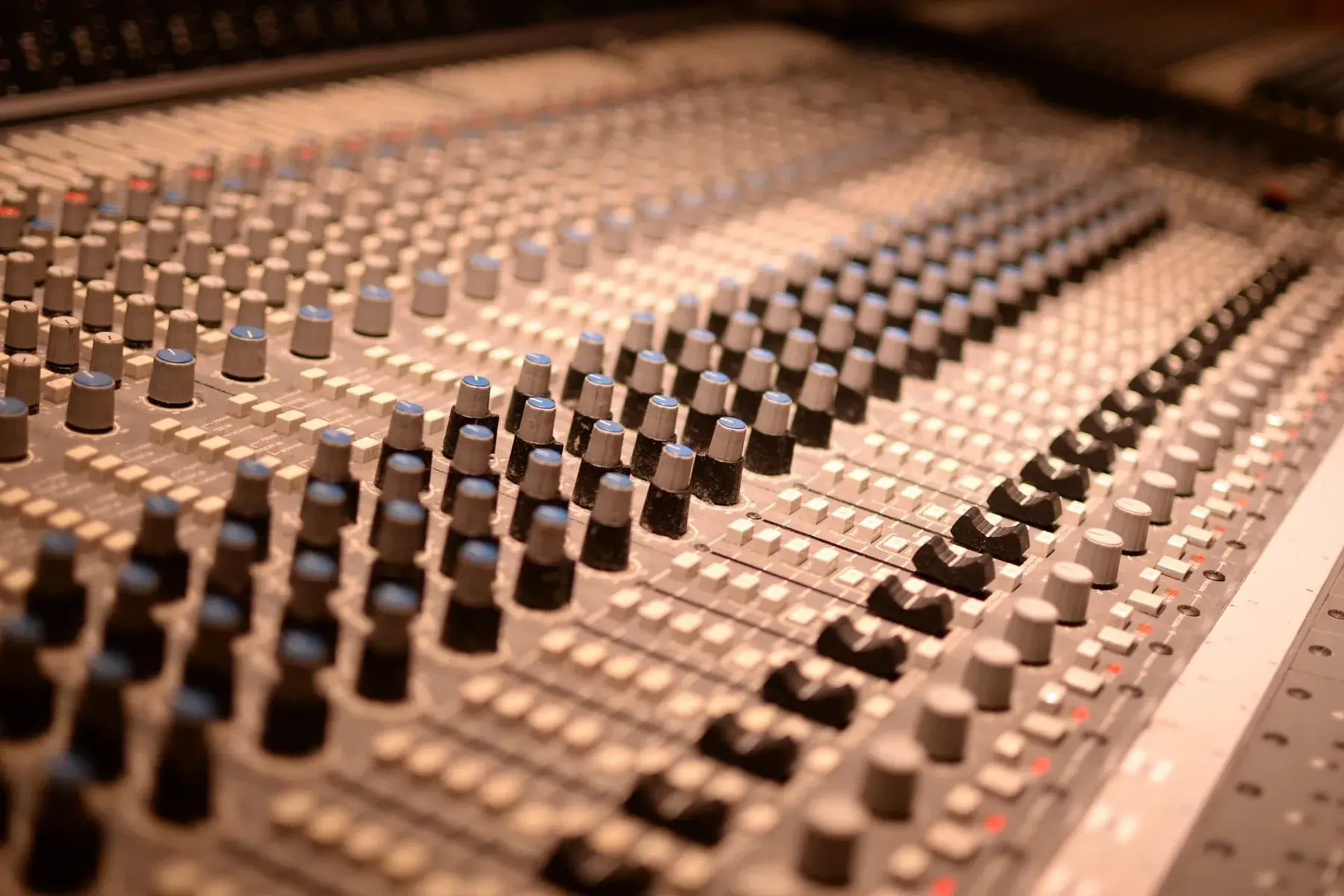 Close-up of an analogue mixing console.